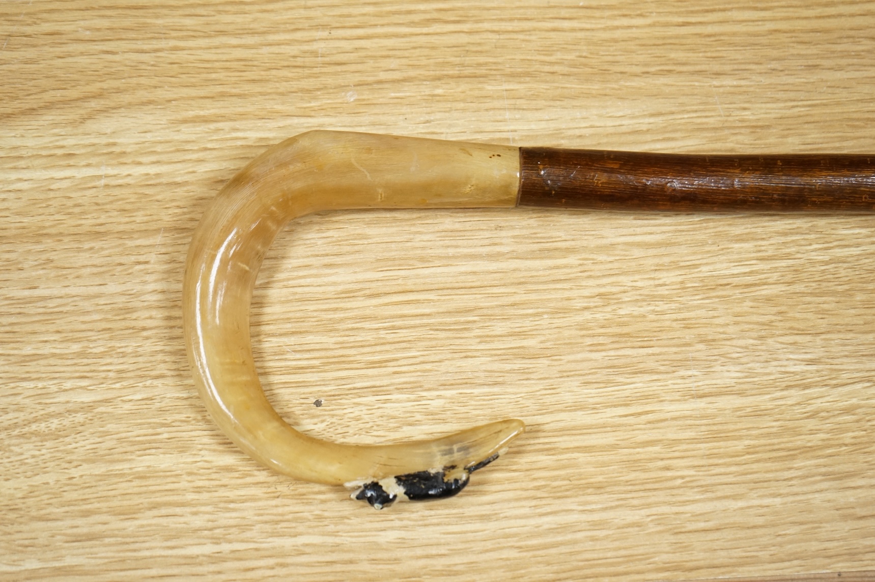 An early to mid 20th century painted wood and horn shepherd’s crook, 132cm in length